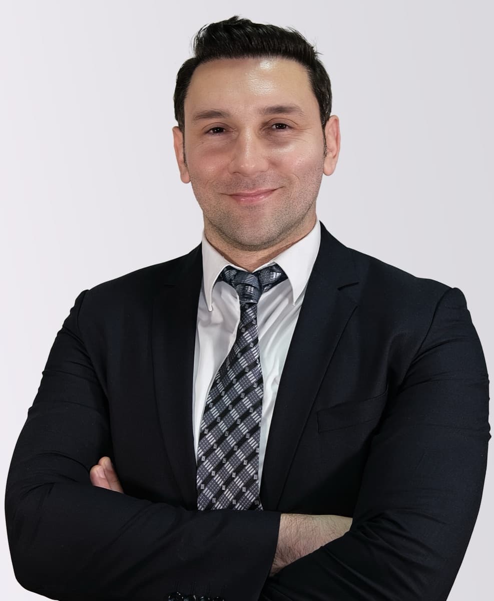 Metin Esgin, founder and project leader of CiteHub, standing with arms crossed